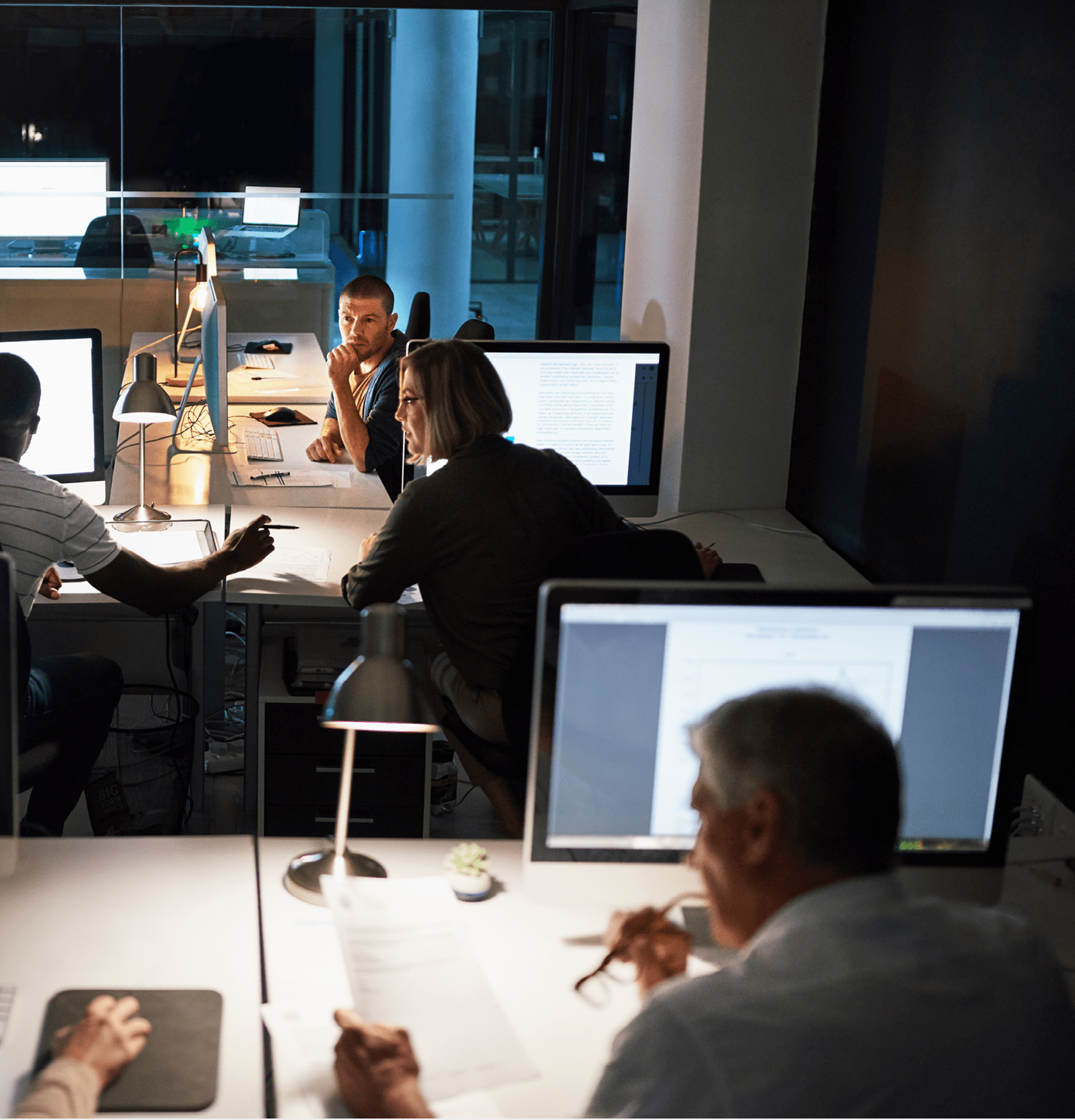 Shot of businesspeople working late in an office