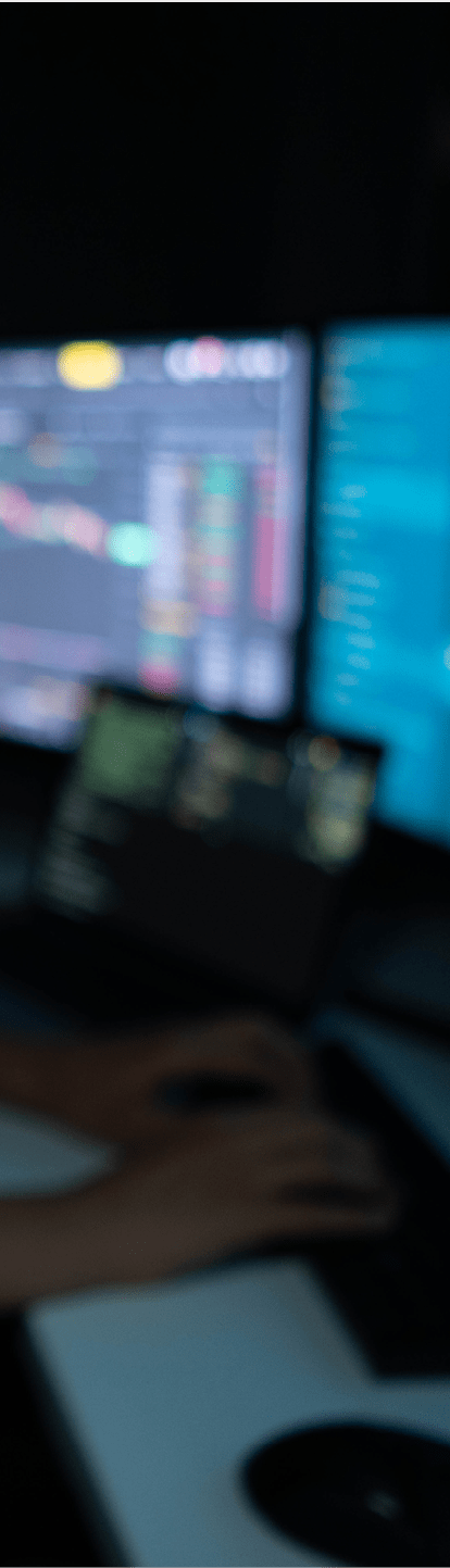 Man working on multi displays professional environment